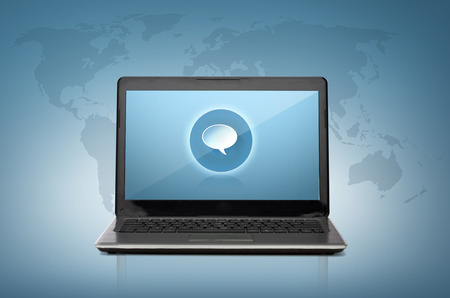 technology and advertisement concept - laptop computer with text bubble on screen