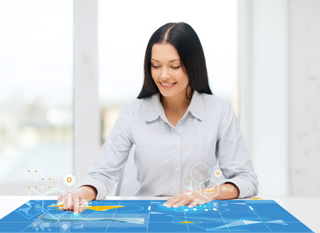 business, education and technology concept - smiling woman pointing to something or pressing...