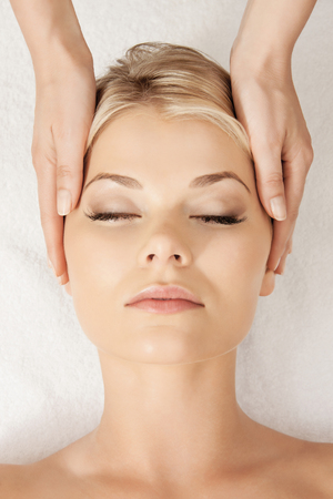 picture of calm beautiful woman in massage salonの写真素材