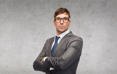 business and office concept - attractive businessman or teacher in glassesの写真素材