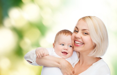 family, child and parenthood concept - happy mother with smiling baby