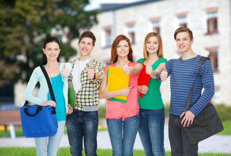 education and people concept - group of smiling students standingの写真素材