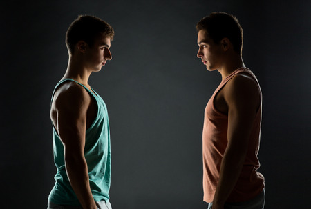 young men looking to each otherの写真素材