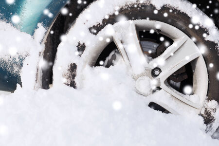 transportation, winter and vehicle concept - closeup of car wheelの写真素材