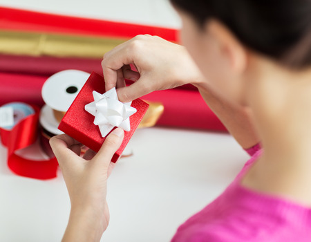 close up of woman decorating christmas presentの写真素材