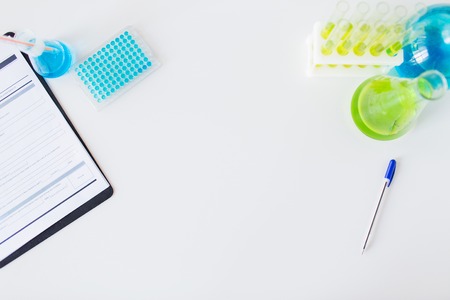 science, chemistry, biology, medicine and advertisement concept - close up of scientific laboratory table with stuff