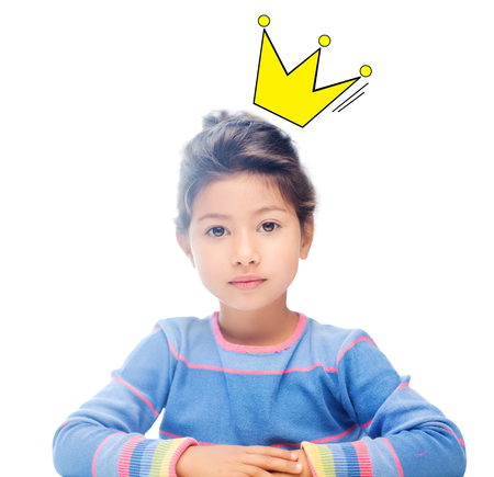 childhood, people, royalty and happiness concept - little girl with crown doodle over headの写真素材