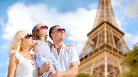 summer holidays, travel, tourism and people concept - happy family in paris over eiffel tower backgroundの写真素材