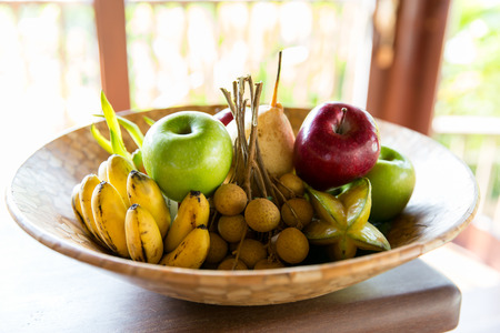 food, eco, bio and summer holidays concept - still life with exotic tropical fruitsの写真素材