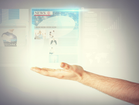 business, technology, internet and news concept - man with virtual screen reading newsの写真素材