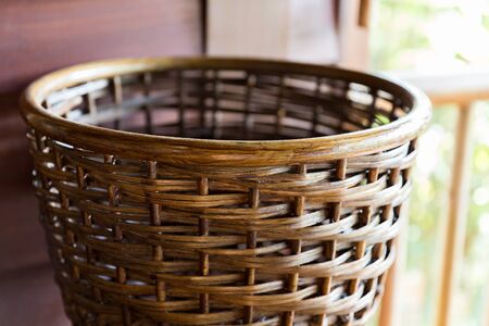 wickerwork, crafts and interior accessories concept - close up of wicker basket
