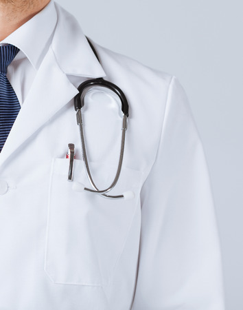 bright close up of male doctor with stethoscopeの写真素材