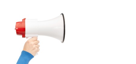 business, people and public announcement concept - closeup of female hand with megaphoneの写真素材