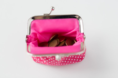 finance, cash, money saving and investment concept - close up of euro coins in wallet on table