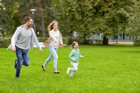 family, parenthood, leisure and people concept - happy mother, father and little girl running and playing catch game in summer park family, parenthood, leisure and people concept - happy mother, father and little girl running and playing catch game in summer park