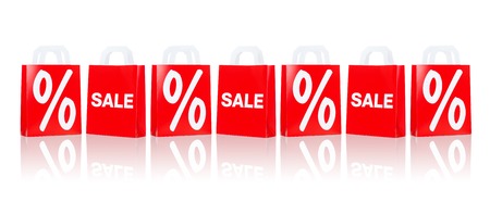 sale, consumerism, discount, advertisement and retail concept - many red shopping bags with...