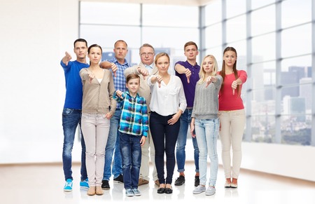 gesture, family, real estate, accommodation and generation concept - group of people giving thumbs...