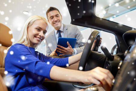 auto business, car sale, technology and people concept - happy woman and car dealer with tablet pc...