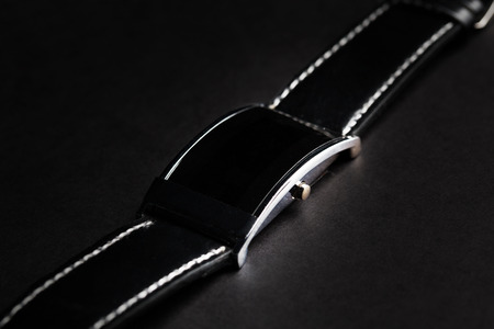 modern technology, time, object and media concept - close up of black smart watchの写真素材