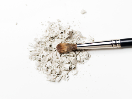 cosmetics, makeup and beauty concept - close up of makeup brush and eyeshadowの写真素材