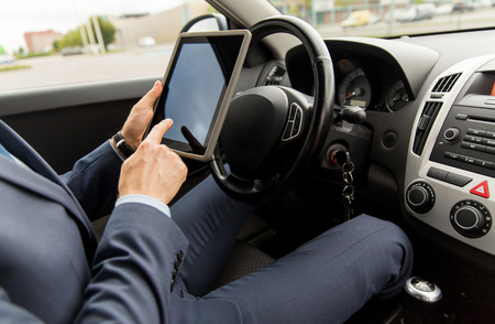 transport, business trip, technology and people concept -close up of young man with tablet pc...