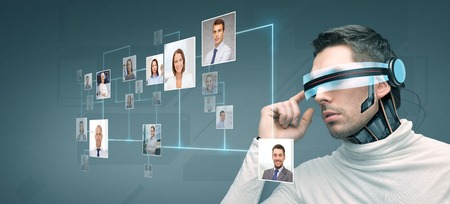 people, technology, future and progress - man with futuristic 3d glasses and microchip implant or...