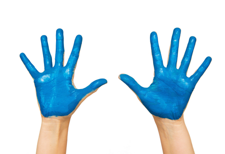 people, body parts and creativity concept - human hand painted with blue colorの写真素材