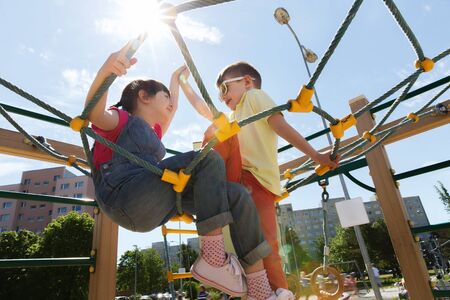 summer, childhood, leisure, friendship and people concept - group of happy kids on children...