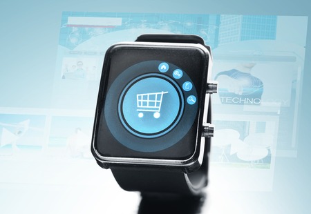 modern technology, object and media concept - close up of black smart watch with shopping cart on...