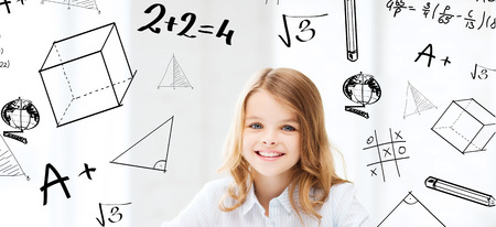 education and school concept - little student girl studying at school