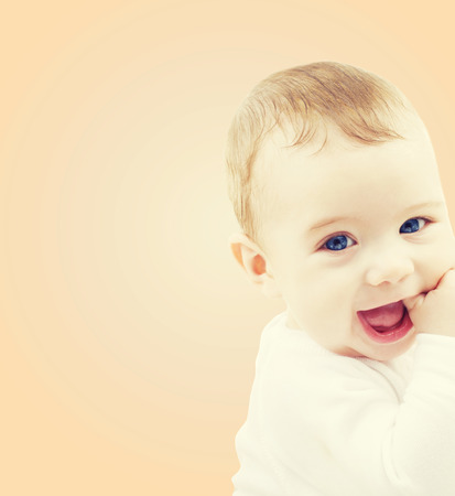 child, people and happiness concept - adorable baby boyの写真素材