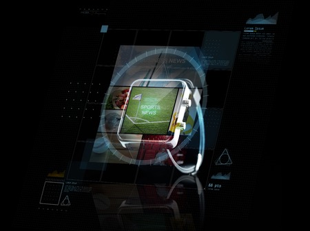 modern technology, internet, object and media concept - close up of black smart watch with sport news application an virtual screen projectionの写真素材
