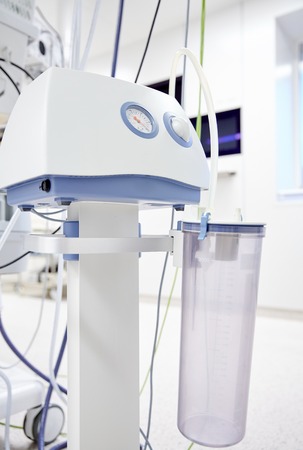 medicine, health care, emergency and medical equipment concept - vacuum aspirator at hospital ward or operating roomの写真素材