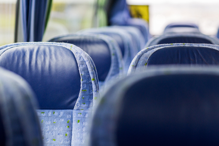 transport, tourism, road trip and equipment concept - travel bus interior and seatsの写真素材