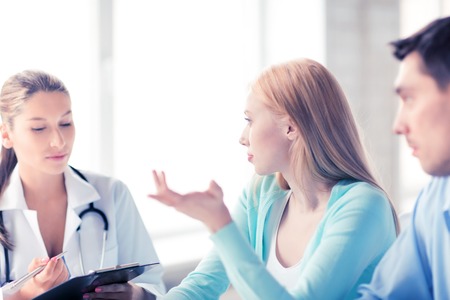 bright picture of doctor with patients in cabinetの写真素材