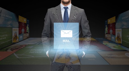 business, communication, multimedia and people concept - close up of businessman in suit with email iconの写真素材