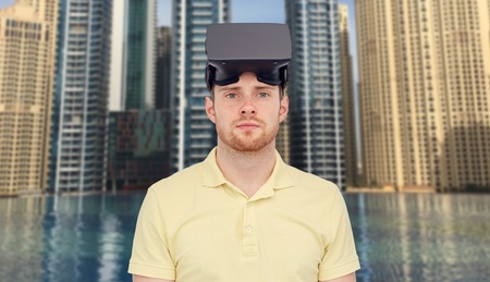young man with virtual reality headset or 3d glasses over city infinity edge pool background