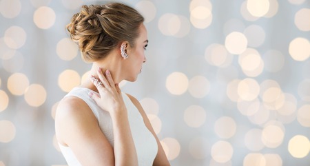 glamour, beauty, jewelry and luxury concept - close up of beautiful woman with golden ring and...