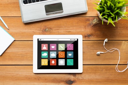 education, business, media and technology concept - close up of tablet pc computer, laptop and...