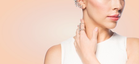 glamour, beauty, jewelry and luxury concept - close up of beautiful woman with golden ring and...