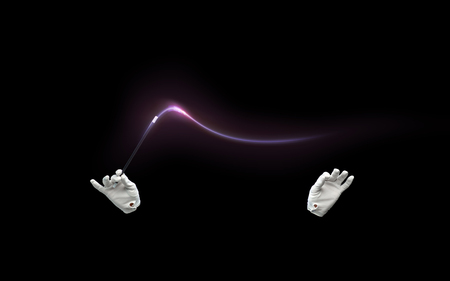 performance, illusion, circus, show concept - magician hands in gloves with illuminating magic wand...