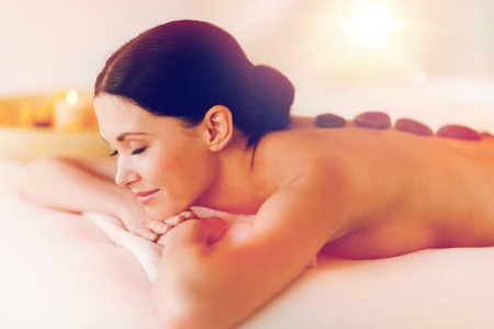 picture of woman in spa salon with hot stonesの写真素材