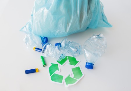 waste recycling, reuse, garbage disposal, environment and ecology concept - close up of used crashed...