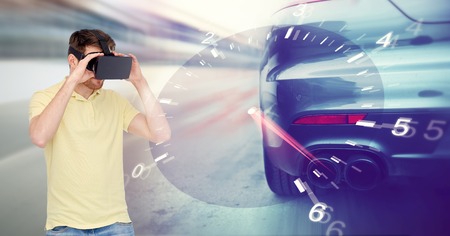 3d technology, virtual reality, entertainment and people concept - young man with virtual reality headset or 3d glasses playing car racing game over tachometer and street race backgroundの写真素材