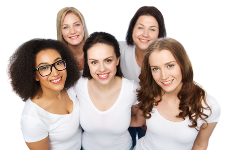 friendship, diverse, body positive and people concept - group of happy different size women in white t-shirtsの写真素材