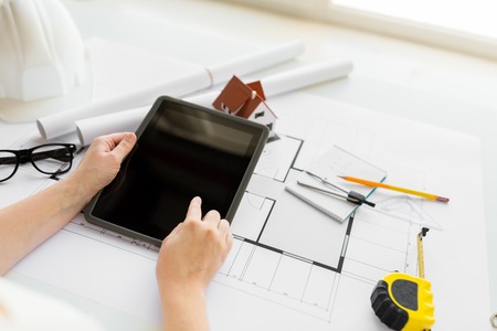 business, architecture, building, construction and people concept - close up of architect hand with...