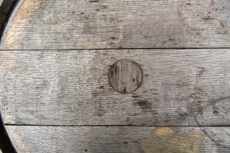 storage, winery, container and object concept - close up of old wooden barrel outdoorsの写真素材