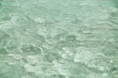 travel, tourism, vacation and summer holidays concept - sea or ocean blue transparent water