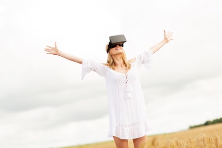 augmented reality, gaming, summer holidays, technology and people concept - happy young woman with...