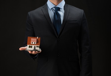 architecture, building, construction, real estate and property concept - close up of businessman or...